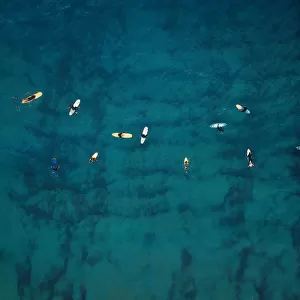 Aerial view of a group of surfers. Abstract Background