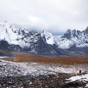 Backpacker with tombstone mountain