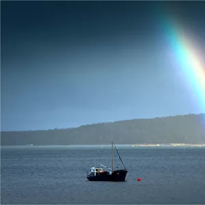 Rainbow during a storm at Dover, in the southern area of the island state, Tasmania, Australia