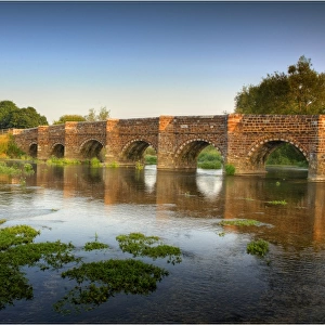 The Stour river and historic bridge at Sturminster Marshall, Dorset, England, United Kingdom