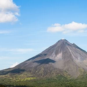 Arenal volcano in a sunny day with blue sky, Alajuela, Costa Rica
