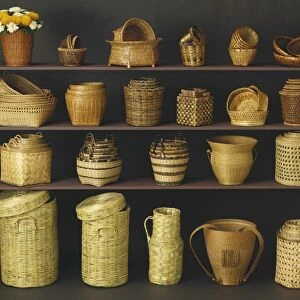 Wicker baskets and bowls on shelf