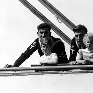 Prince Charles and Princess Anne on board the Royal yacht Britannia sailing into