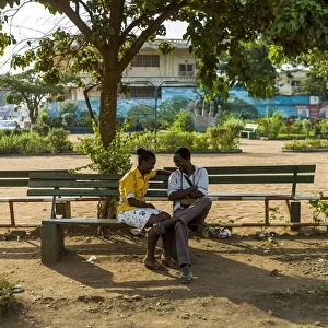 A couple speaks in a park in the centre of Bangui, Central African Republic, on February 13