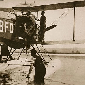 Alan Cobham climbing into his plane before setting off for Australia, Rochester
