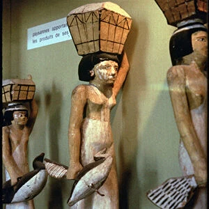 Female bearers bringing offerings for the deceased, from the cemetery at Assiut, Middle Kingdom, c. 2060-1786 BC (plaster and figwood)