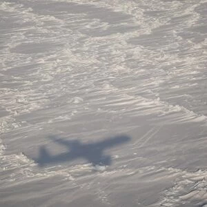 A DC-8 aircraft casts its shadow over the Bering Sea