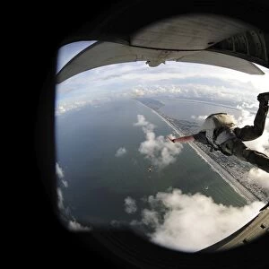 pararescuemen jumps from an HC-130P / N King