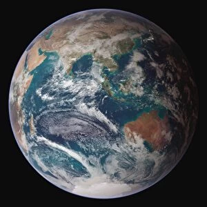 A full view of Earth showing global data for land surface, polar sea ice, and chlorophyll