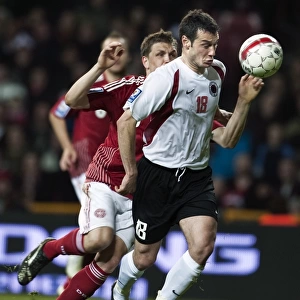 Denmarks Michael Jacobsen and Albanias Hamdi Salihi fight for the ball during their 2010 World Cup qualifying soccer match in Copenhagen