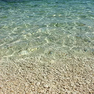 Aqua Ocean and Golden Pebbles