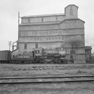 Grain elevator along railroad yard, North Platte, Nebraska, 1939. Creator: Dorothea Lange