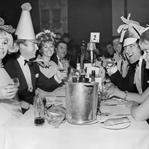 Bobby Moore, and wife Tina Moore across the table from Terry Venables and his wife 1967 at a New Years Party