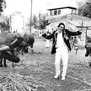 England Cricketer Derek Randall with water buffalo in India