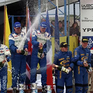 World Rally Championship, Rally of Argentina, May 16-19, 2002. The top three crews celebrate on the podium. Photo: Ralph Hardwick/LAT