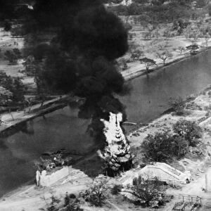 The Battle For Mandalay: A burning pagoda near Port Dufferin. Circa 1940s