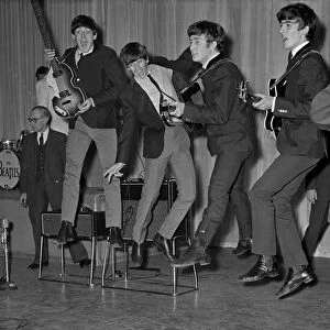The Beatles play about and jump in the air during the rehearsals for the Royal Variety
