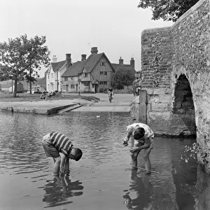 Boys fishing for tadpoles in Eynsford, Kent. 25th May 1961