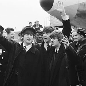 British pop group The Beatles wave to fans on their arrival in New York for the band
