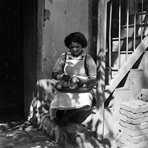 A local woman peeling oranges in a town in Cyprus. March 1952 C1296