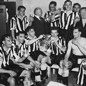 The Newcastle team in their dressing room at Wembley celebrate their one nil victory over