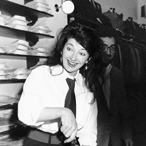 Pop singer Kate Bush cuts her 30th birthday cake at Blazers Boutique where she was