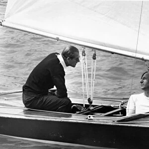 Prince Philip, Duke of Edinburgh, sails "Coweslip at Cowes with crewman John Collis
