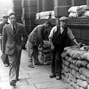 Sandbags are placed for the protection of buildings in Newcastle in prepartion for air