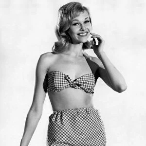 Woman wearing a check patterned bikini with unusual pants June 1962 P011070