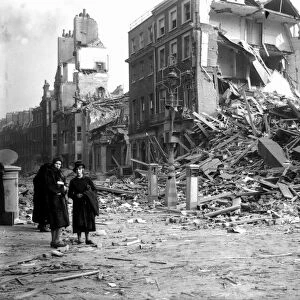 WW2 Air Raid Damage Bomb damage in London People survey the damaged buildings