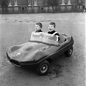 Young drivers: Small boys driving miniature cars. January 1966 F94